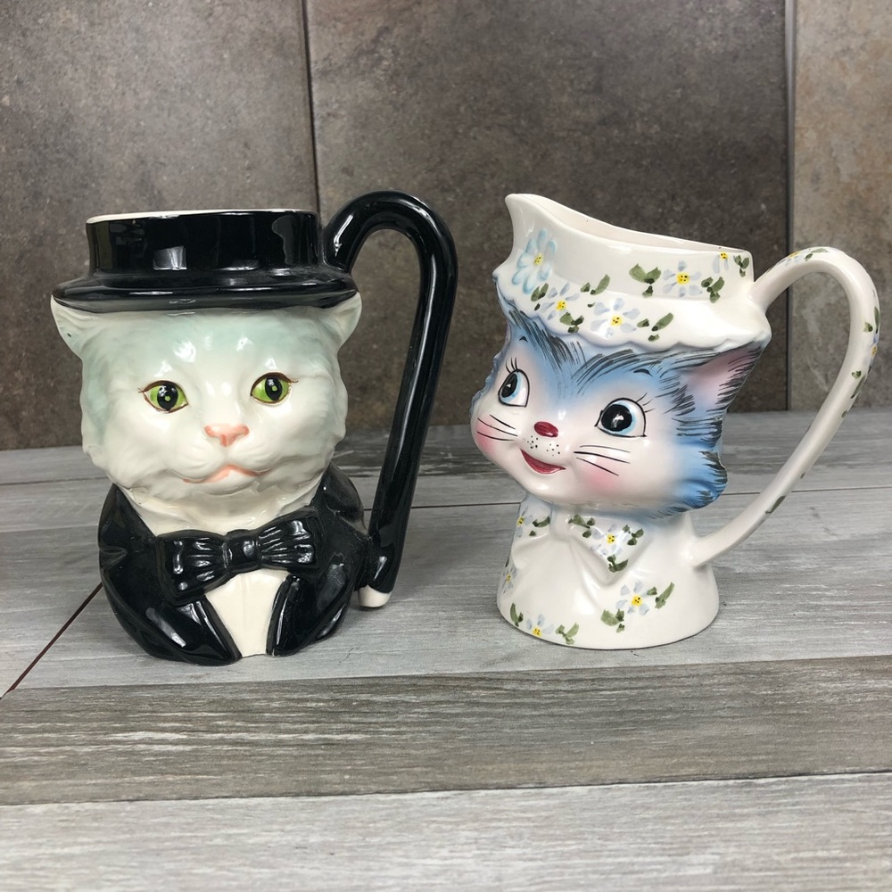 Two ceramic style cat dispensers